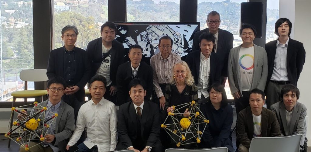 Photo of Alice Agogino (center) gave a presentation and demonstration to a group of Japanese businesspeople during their visit to Squishy Robotics.